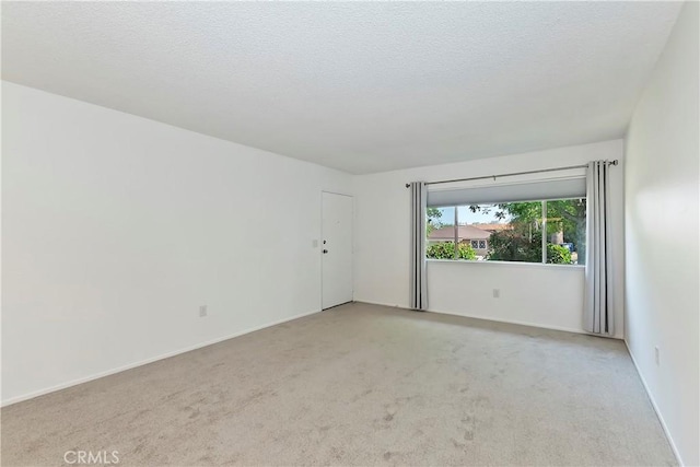 22789 Palm Ave Unit B, Grand Terrace, CA 92313 - carpeted spare room with a textured ceiling