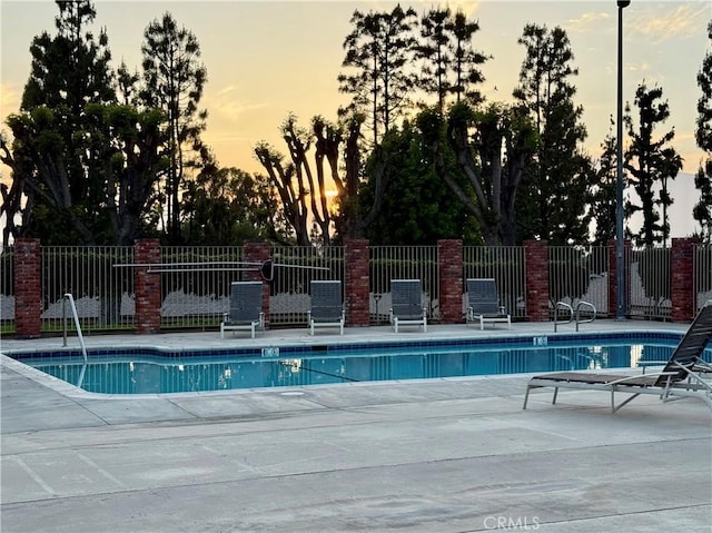 22789 Palm Ave Unit B, Grand Terrace, CA 92313 - pool at dusk featuring a patio area and a community pool