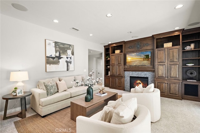 3016 Milagro Way, Fullerton, CA 92835 - living area featuring recessed lighting, a glass covered fireplace, light colored carpet, and baseboards