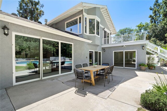 3016 Milagro Way, Fullerton, CA 92835 - back of property with a patio, an outdoor pool, stucco siding, and outdoor dining space