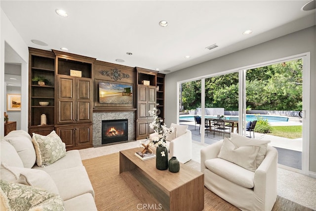 3016 Milagro Way, Fullerton, CA 92835 - living area with recessed lighting, a fireplace with flush hearth, and light colored carpet