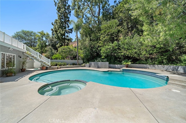 3016 Milagro Way, Fullerton, CA 92835 - view of pool featuring stairs, a patio area, a pool with connected hot tub, and view of scattered trees