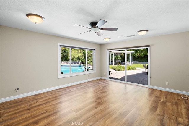3016 Milagro Way, Fullerton, CA 92835 - unfurnished room featuring a ceiling fan, wood finished floors, a textured ceiling, and baseboards