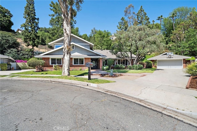 3016 Milagro Way, Fullerton, CA 92835 - view of front of property featuring brick siding, driveway, a front yard, an outbuilding, and a garage