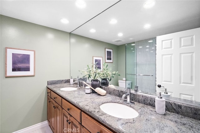3016 Milagro Way, Fullerton, CA 92835 - bathroom featuring toilet, double vanity, recessed lighting, baseboards, and a shower