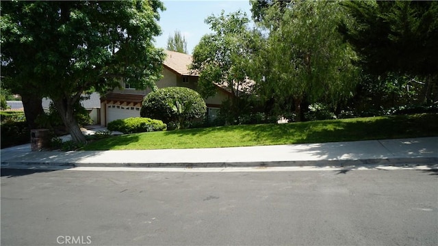 24530 Breckenridge Pl, Newhall, CA 91321 - view of property hidden behind natural elements featuring a front yard