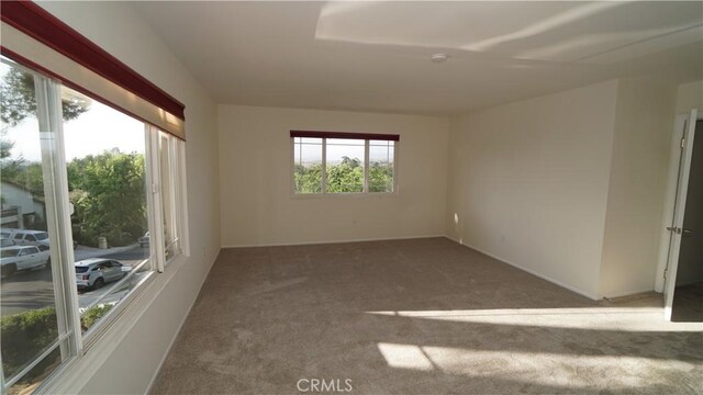 24530 Breckenridge Pl, Newhall, CA 91321 - carpeted empty room featuring baseboards