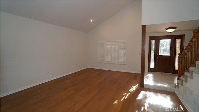 24530 Breckenridge Pl, Newhall, CA 91321 - entryway with stairway, high vaulted ceiling, wood finished floors, and baseboards