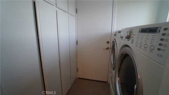 24530 Breckenridge Pl, Newhall, CA 91321 - laundry room with washer and dryer, cabinet space, and light tile patterned floors