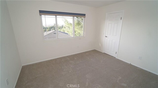24530 Breckenridge Pl, Newhall, CA 91321 - carpeted empty room featuring baseboards
