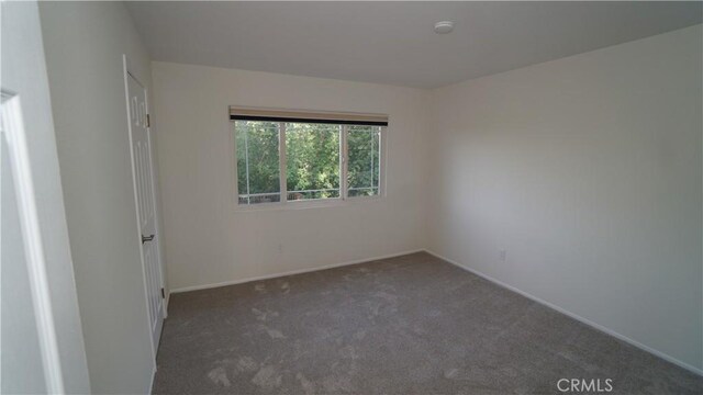 24530 Breckenridge Pl, Newhall, CA 91321 - empty room with carpet floors and baseboards