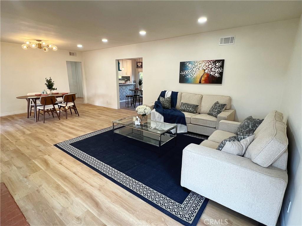 14900 Blackhawk St, Mission Hills San Fernando, CA 91345 - living room with light wood-style floors, recessed lighting, and baseboards