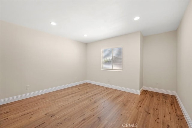2101 W 76th St, Los Angeles, CA 90047 - empty room featuring light wood-style floors, baseboards, and recessed lighting