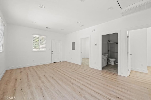 2101 W 76th St, Los Angeles, CA 90047 - unfurnished bedroom with attic access, electric panel, light wood-style floors, baseboards, and recessed lighting