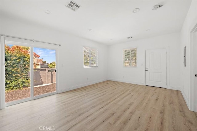2101 W 76th St, Los Angeles, CA 90047 - unfurnished room with healthy amount of natural light, light wood-style flooring, and recessed lighting