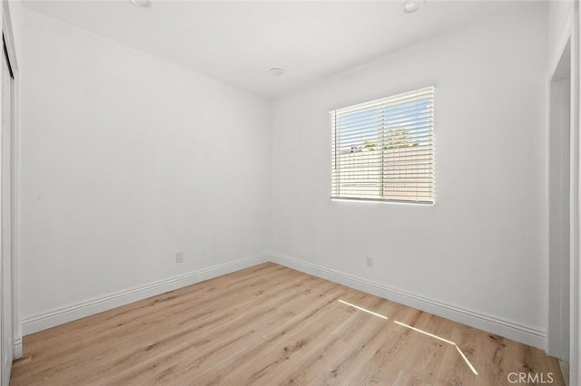 2101 W 76th St, Los Angeles, CA 90047 - unfurnished room featuring wood finished floors and baseboards