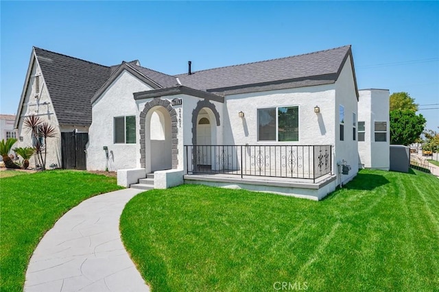 2101 W 76th St, Los Angeles, CA 90047 - view of front facade featuring a front lawn, stucco siding, and a porch
