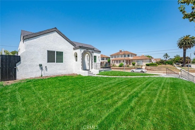 2101 W 76th St, Los Angeles, CA 90047 - rear view of property with stucco siding