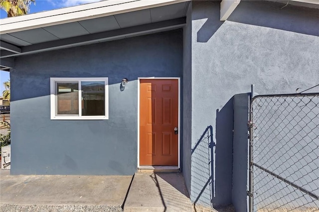 5951 Rose Ellen Ave Unit 29, Palms, CA 92277 - property entrance featuring stucco siding and a gate