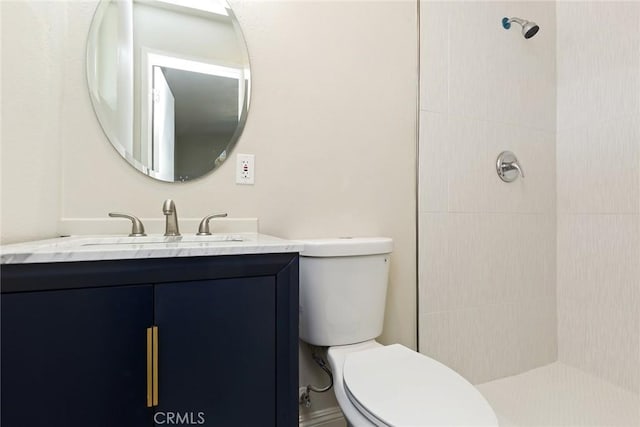 5951 Rose Ellen Ave Unit 29, Palms, CA 92277 - full bathroom featuring toilet, tiled shower, and vanity