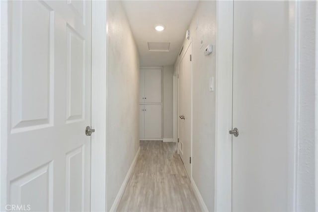 5951 Rose Ellen Ave Unit 29, Palms, CA 92277 - corridor featuring light wood-style flooring, baseboards, attic access, and recessed lighting