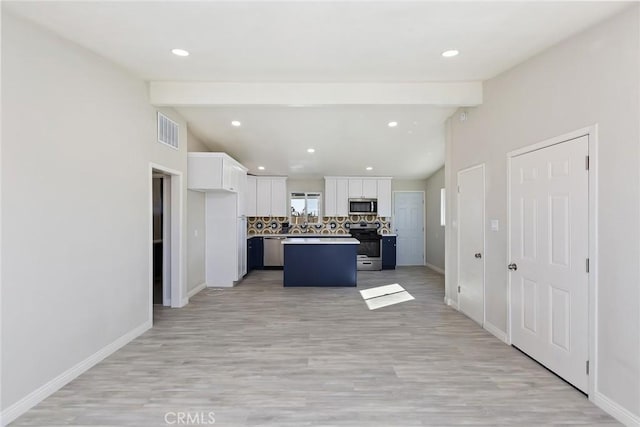 5951 Rose Ellen Ave Unit 29, Palms, CA 92277 - kitchen featuring stainless steel appliances, white cabinetry, backsplash, baseboards, and recessed lighting