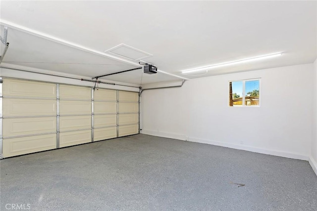 5951 Rose Ellen Ave Unit 29, Palms, CA 92277 - garage featuring baseboards and a garage door opener