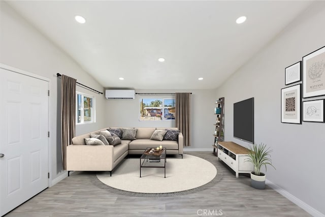 5951 Rose Ellen Ave Unit 29, Palms, CA 92277 - living room featuring a wall mounted AC, baseboards, light wood-style flooring, lofted ceiling, and recessed lighting