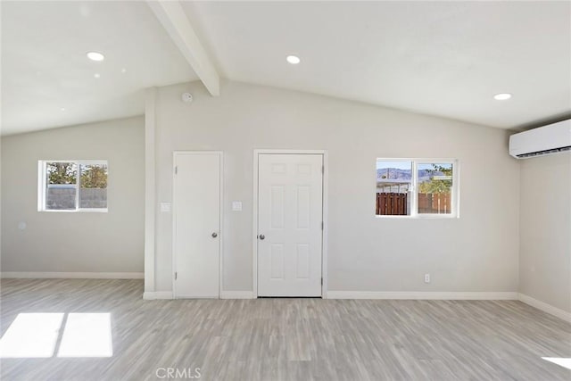 5951 Rose Ellen Ave Unit 29, Palms, CA 92277 - spare room with a wall mounted air conditioner, light wood-style flooring, plenty of natural light, baseboards, and recessed lighting
