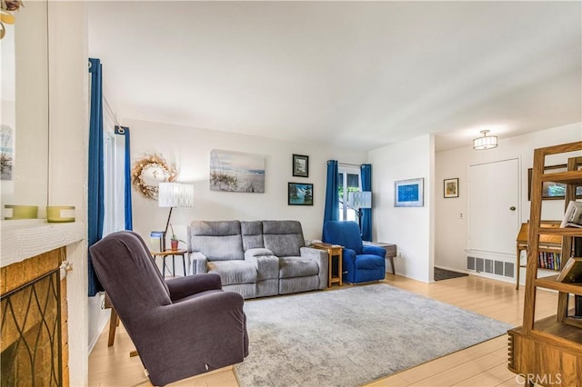 449 Heatherglen Ln, San Dimas, CA 91773 - living room featuring light wood-type flooring and a fireplace