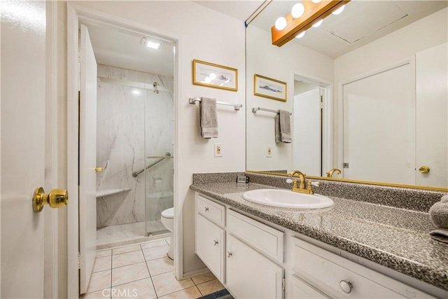 449 Heatherglen Ln, San Dimas, CA 91773 - bathroom featuring a marble finish shower, toilet, vanity, and tile patterned flooring