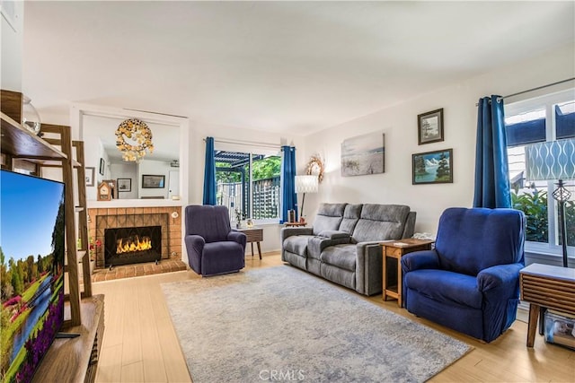 449 Heatherglen Ln, San Dimas, CA 91773 - living area with wood finished floors and a brick fireplace