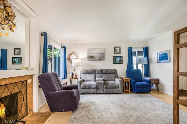 449 Heatherglen Ln, San Dimas, CA 91773 - living room featuring wood finished floors and a lit fireplace