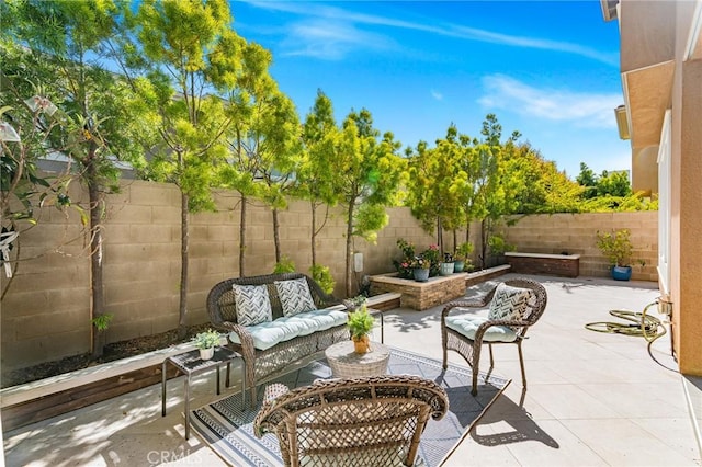 62 Pelican Ln, Irvine, CA 92618 - fenced backyard with an outdoor hangout area and a patio