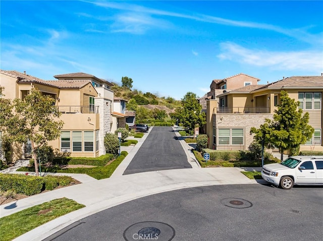 62 Pelican Ln, Irvine, CA 92618 - view of asphalt road featuring a residential view