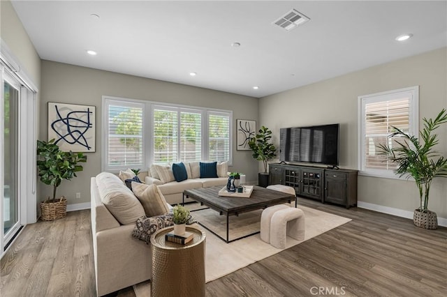 62 Pelican Ln, Irvine, CA 92618 - living room featuring baseboards, wood finished floors, and recessed lighting