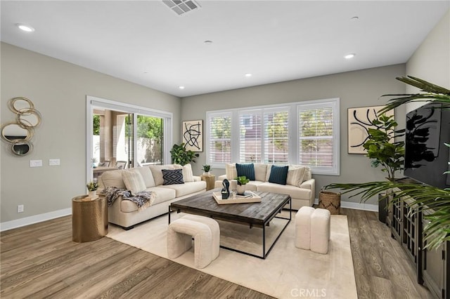 62 Pelican Ln, Irvine, CA 92618 - living room featuring wood finished floors, baseboards, and recessed lighting