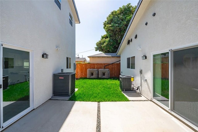 939 E 97th St, Los Angeles, CA 90002 - view of yard with central AC unit and a patio