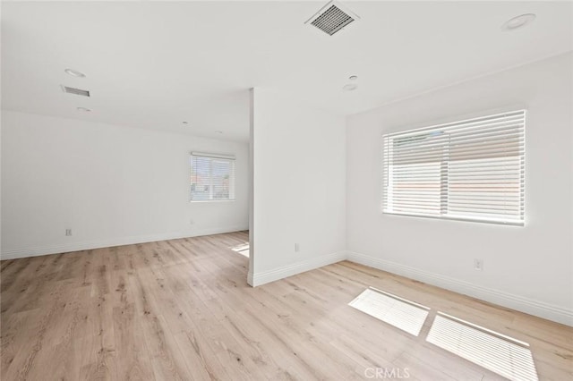 939 E 97th St, Los Angeles, CA 90002 - unfurnished room with light wood-style floors and baseboards