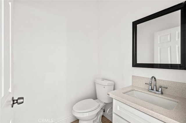 939 E 97th St, Los Angeles, CA 90002 - half bath featuring vanity, toilet, and baseboards