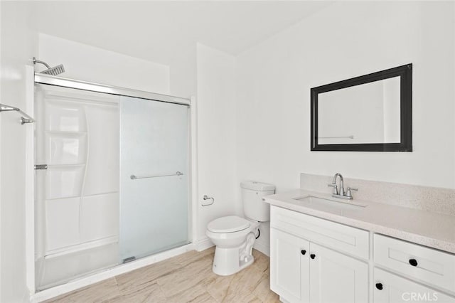 939 E 97th St, Los Angeles, CA 90002 - full bath with a stall shower, vanity, toilet, and baseboards