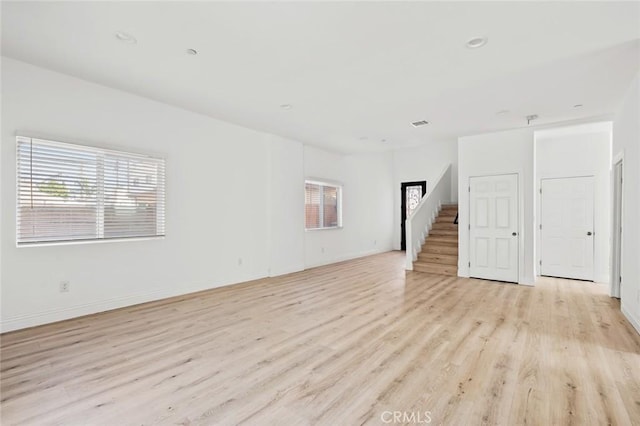 939 E 97th St, Los Angeles, CA 90002 - unfurnished room featuring light wood finished floors, baseboards, and recessed lighting
