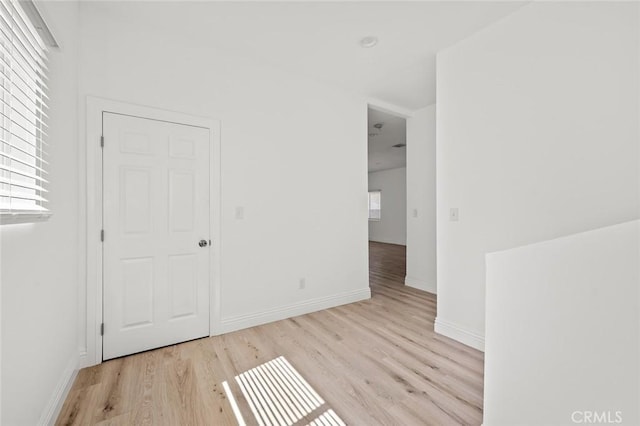 939 E 97th St, Los Angeles, CA 90002 - unfurnished room with wood finished floors, plenty of natural light, and baseboards