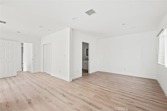 939 E 97th St, Los Angeles, CA 90002 - spare room with light wood-type flooring, baseboards, and recessed lighting
