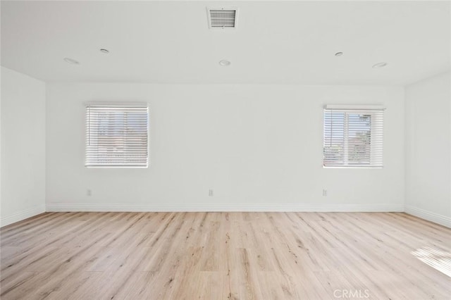 939 E 97th St, Los Angeles, CA 90002 - empty room featuring light wood-style floors and baseboards