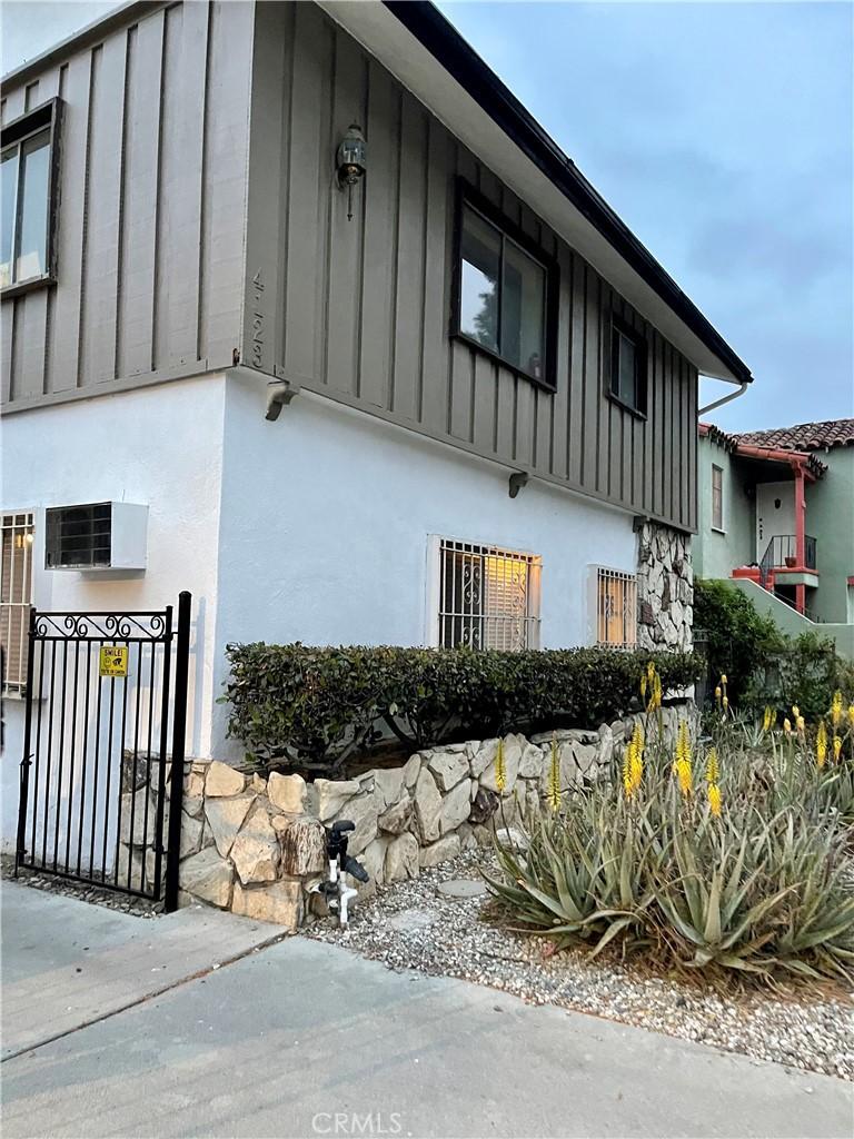 4123 Edenhurst Ave Unit 1, Los Angeles, CA 90039 - view of home's exterior featuring board and batten siding and stucco siding