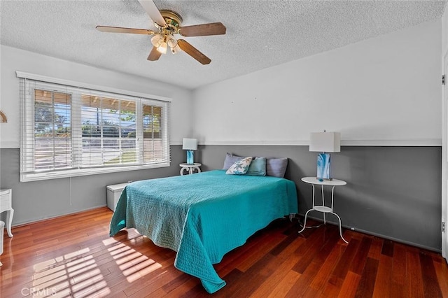 11180 Bertrand Ave, Granada Hills, CA 91344 - bedroom with a textured ceiling, wood finished floors, and ceiling fan