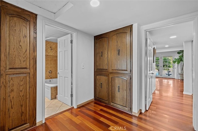 11180 Bertrand Ave, Granada Hills, CA 91344 - hall with light wood finished floors and baseboards
