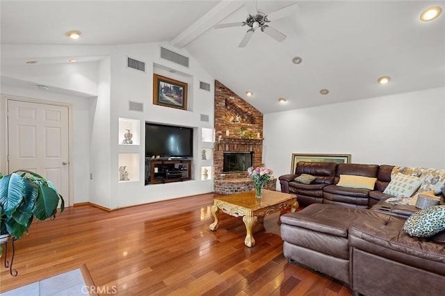 11180 Bertrand Ave, Granada Hills, CA 91344 - living room featuring hardwood / wood-style floors, a ceiling fan, beam ceiling, high vaulted ceiling, and a fireplace