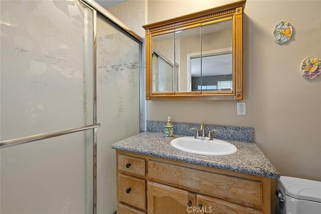 11180 Bertrand Ave, Granada Hills, CA 91344 - bathroom featuring toilet, vanity, and a shower with shower door